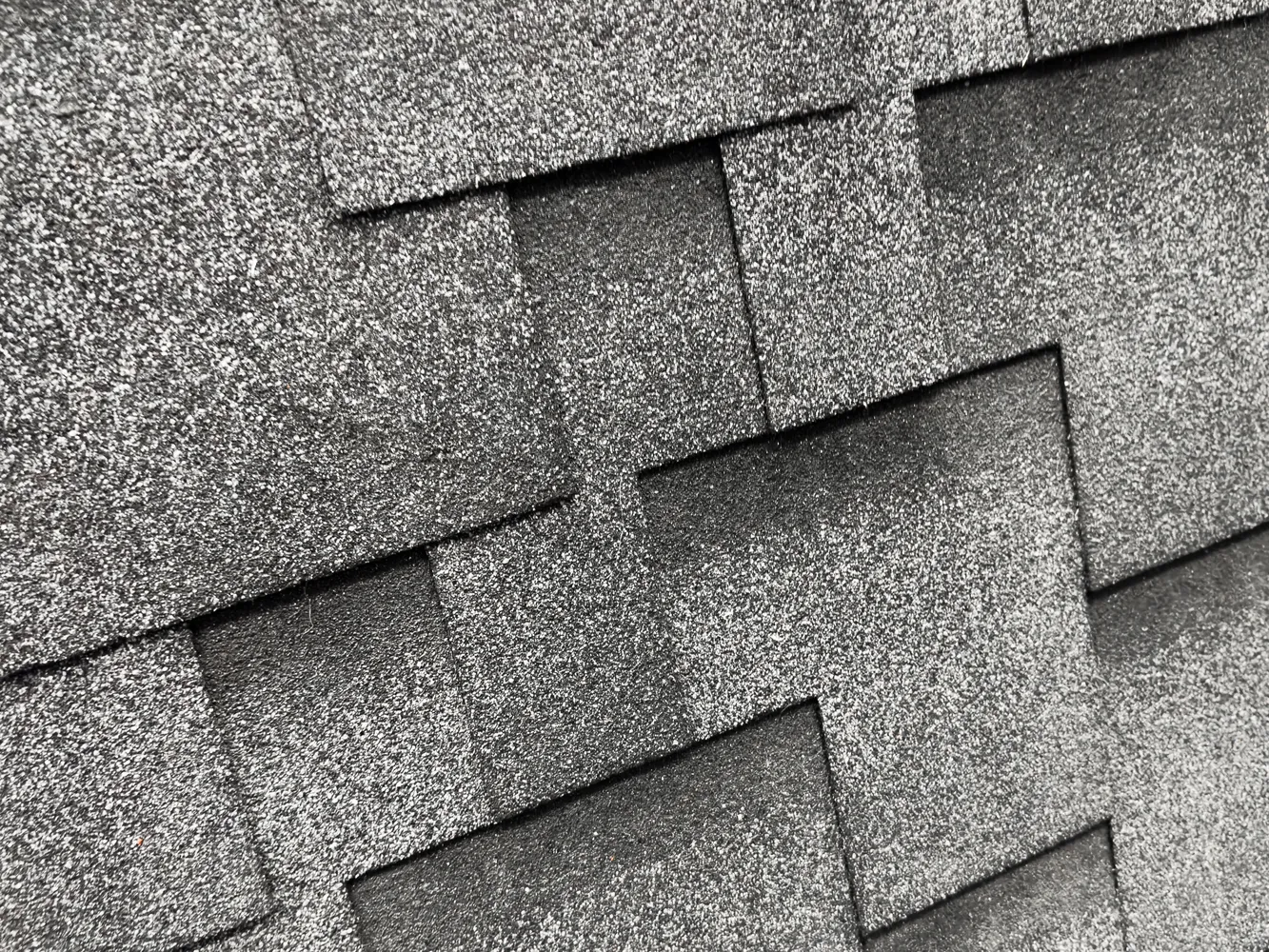 Crew of Roofing Contractors Near Me Measuring Materials for a Repair Job